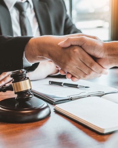 Businessman shaking hands to seal a deal Judges male lawyers Consultation legal services Consulting in regard to the various contracts to plan the case in court.